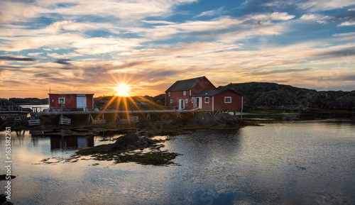Sunrise over fishing stages on changeIslands,Change Islands, Newfoundland & Labrador © David