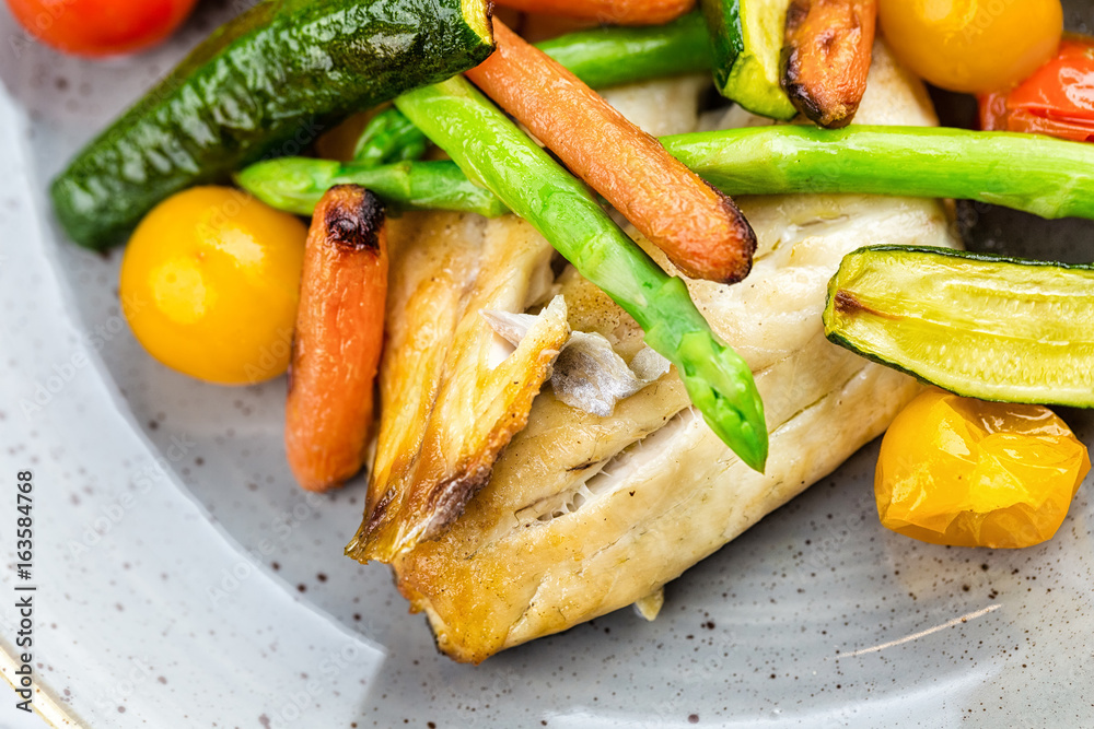 Grilled fish and vegetables with sauce Grilled fish and vegetables with sauce