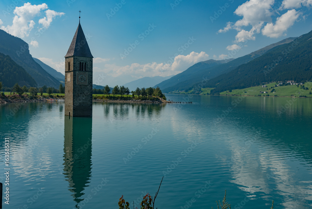 August 2015, Lake Resie, Italy, Trentino Alto Adige. View of the floodlit Campanile.