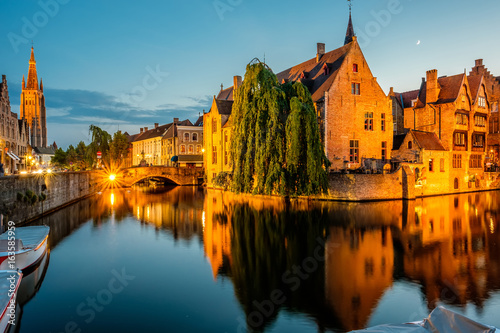 Bruges (Brugge) cityscape with water canal at night