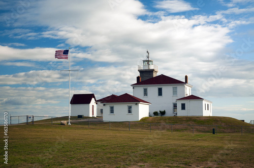 Historic Watch Hill lighthouse with its unique Colonial architecture in Westerly, Rhode Island.