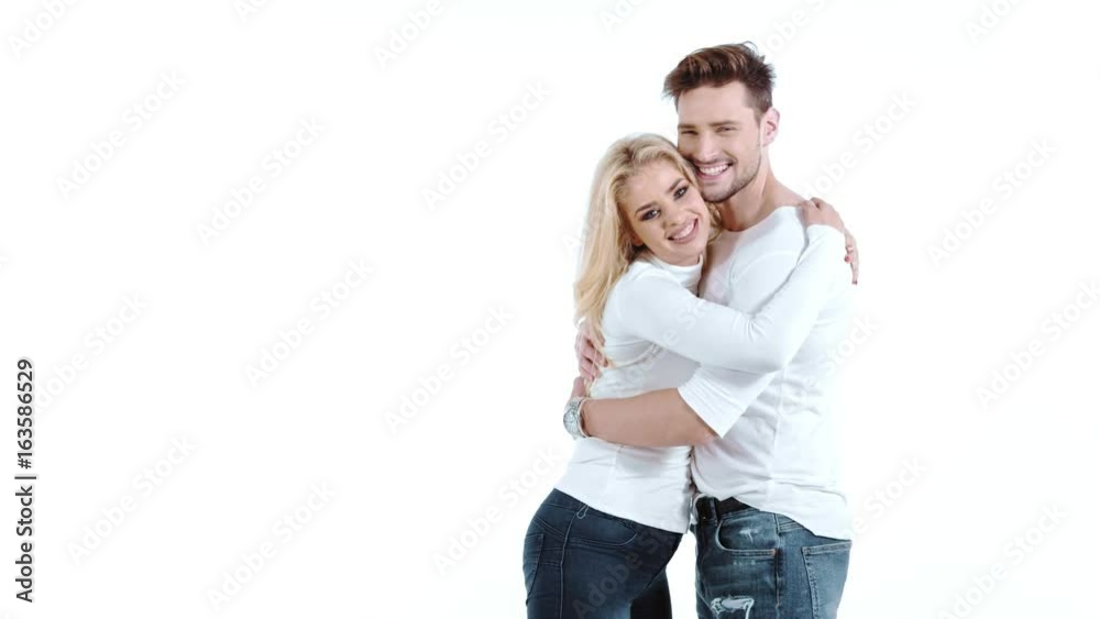 Sexy young couple posing on studio background, 4k slow motion studio clip Sexy young couple posing on studio background, 4k slow motion studio clip