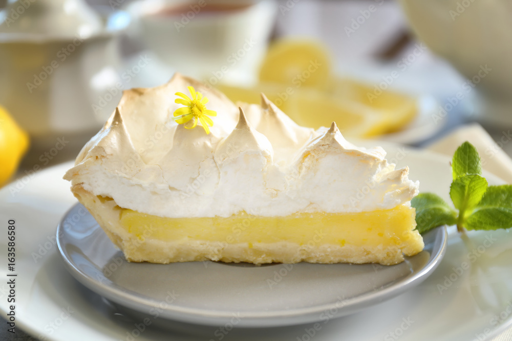 Piece of delicious lemon meringue pie on plate Piece of delicious lemon meringue pie on plate