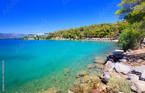 Fototapeta Naklejka Na Ścianę i Meble -  Travel Greece. Spectacular view on one of the most beautiful beaches in Poros Island. Summer holiday