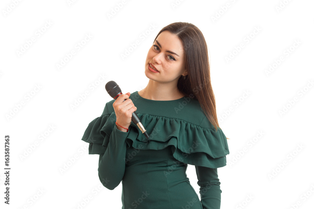 beautiful young brunette with a microphone in her hand beautiful young brunette with a microphone in her hand