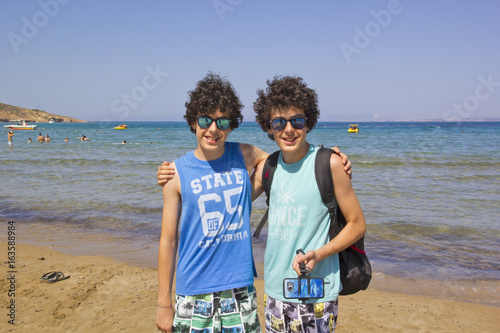 happy twins at the beach photo