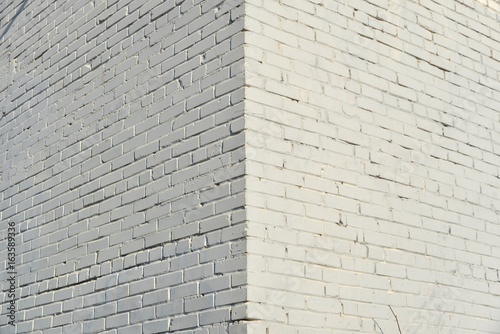 Brick wall painted with white paint.
