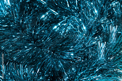 Christmas background. Blue tinsel Christmas decoration seamless background. Shallow depth of field photo