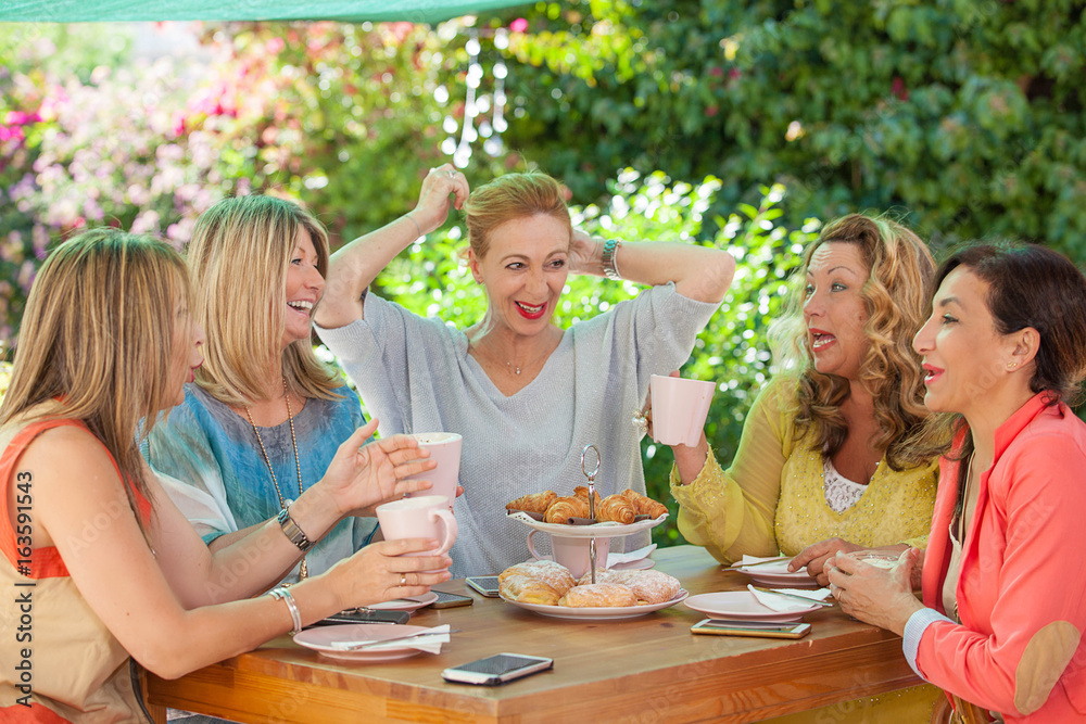 group of women friends meeting for coffee. group of women friends meeting for coffee.