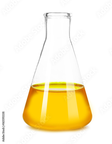 Flask with orange fluid isolated on white