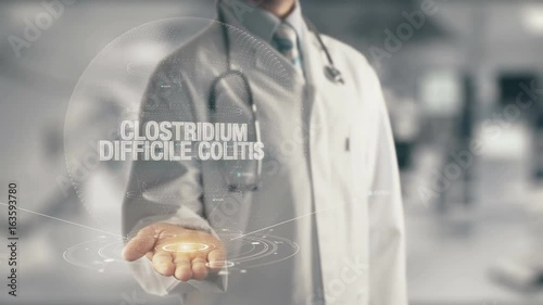 Doctor holding in hand Clostridium Difficile Colitis photo