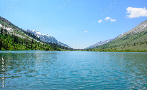 Glacier Mountain with Lake in the Summer with green photo