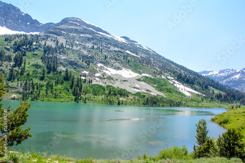 Fototapeta Naklejka Na Ścianę i Meble -  Glacier Mountain with Lake in the Summer with green