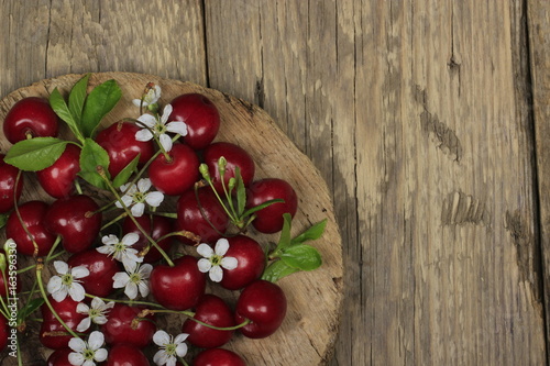 Fresh garden cherry in wooden table