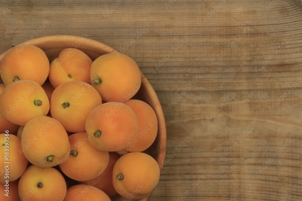 Apricot fruit. Fresh organic apricots on wooden background. Apricot fruit. Fresh organic apricots on wooden background.