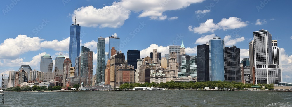 The Freedom Tower, Wall Street, and the skyline of downtown Manhattan from New York Harbor.
