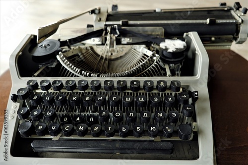 Old black typewriter with round keys