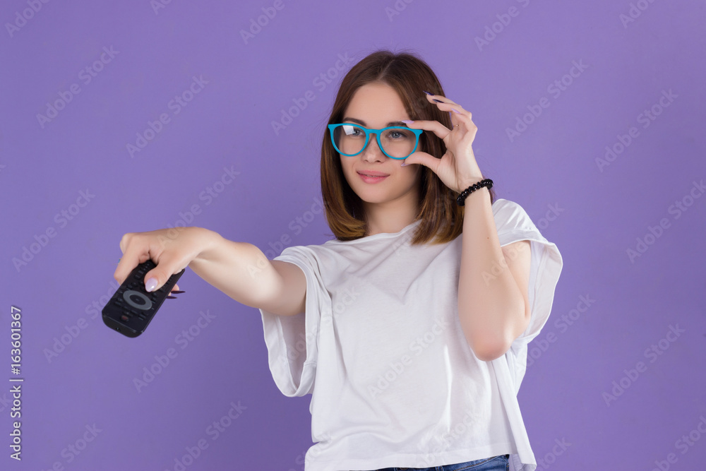 Young pretty woman with remote control, cute girl Young pretty woman with remote control, cute girl