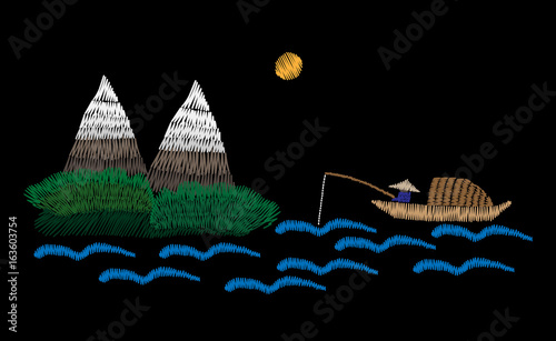 A fisherman is in a boat fishes with mountain landscape embroidery stitches imitation
