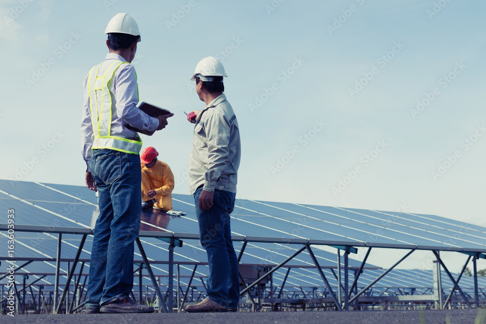 Team engineers checking solar cells. Solar cells have been maintained and maintenance by a team of engineers.