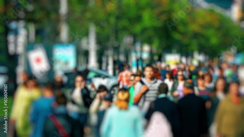 Wallpaper Mural Crowd of People / Commuters Walking / Busy Street. Anonymous crowd on a busy street. People walk down a busy street with green trees on a hot summer day. Slow motion. Torontodigital.ca