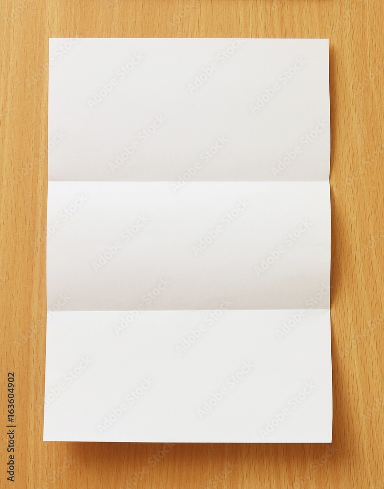 Blank white template paper on wood background with soft shadows. Ready for your design Blank white template paper on wood background with soft shadows. Ready for your design