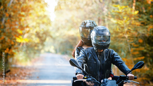 Obraz na płótnie couple biker riding motorcycle