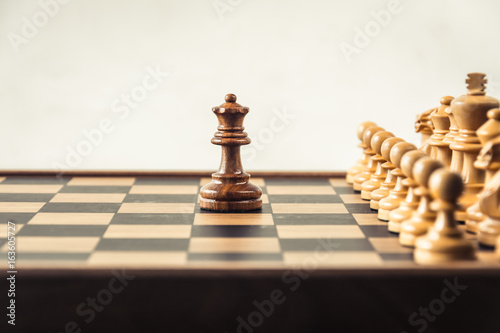 Chess on board white backgroung. Confrontation concept