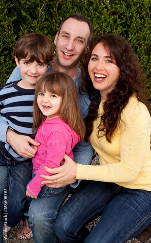 Portrait of happy family smiling and laughing.