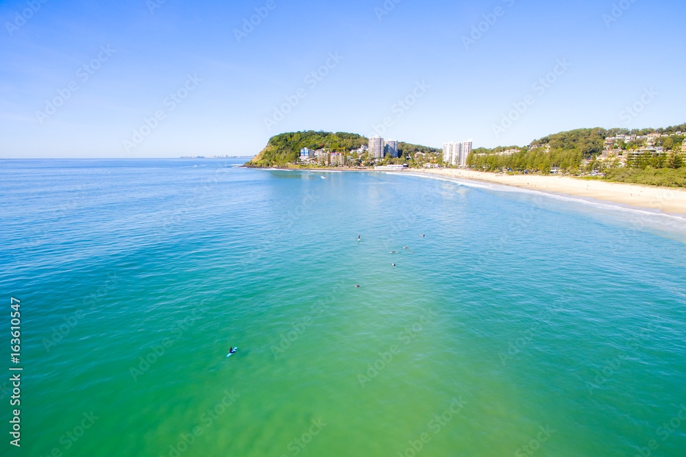 Fototapeta premium An aerial view of Burleigh Heads on a clear day with blue water