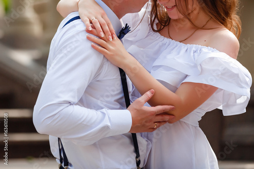 Wedding couple with the stylish bouquet