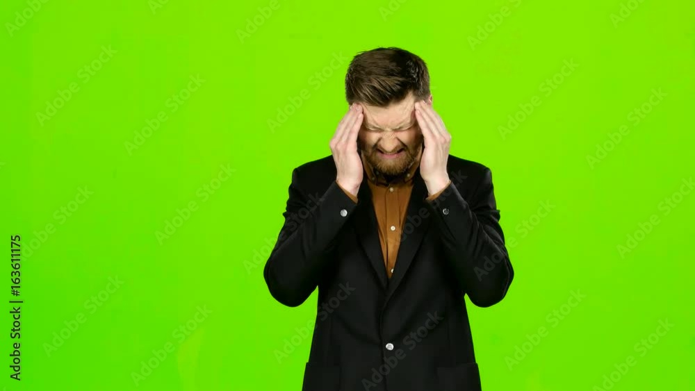 Guy is suffering, his head hurts, he is tired. Green screen Guy is suffering, his head hurts, he is tired. Green screen