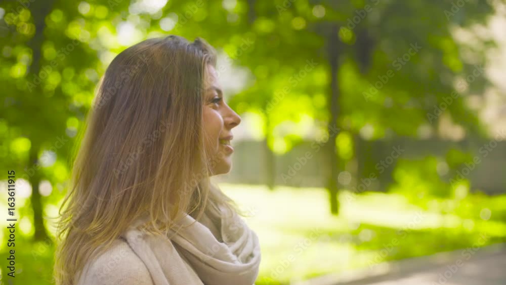 Portrait of young attractive woman against trees Portrait of young attractive woman against trees