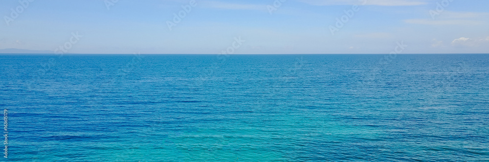 Fototapeta premium Photo of tropical sea. Summer travel and vacation concept - panoramic banner.