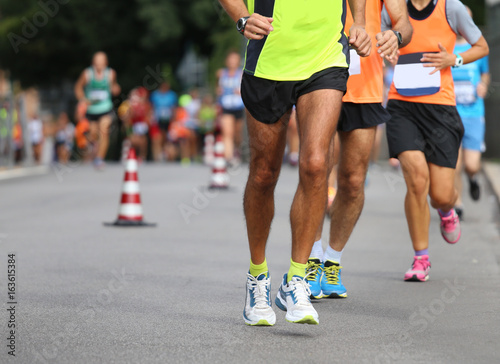 athletes run the marathon on the city road