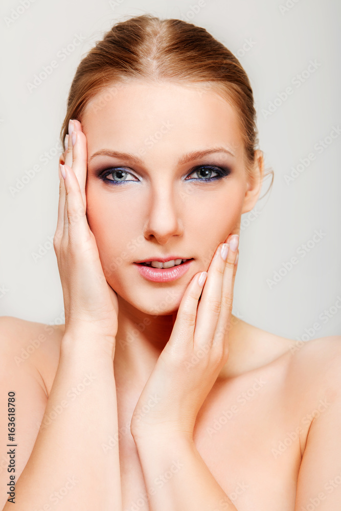 Attractive blonde topless woman with dark eye make up Attractive blonde topless woman with dark eye make up
