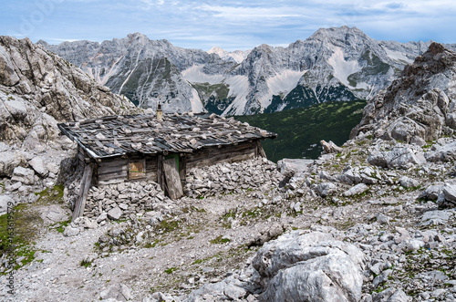 Old Alpine shack in Austria almost destroyed and covered with stones