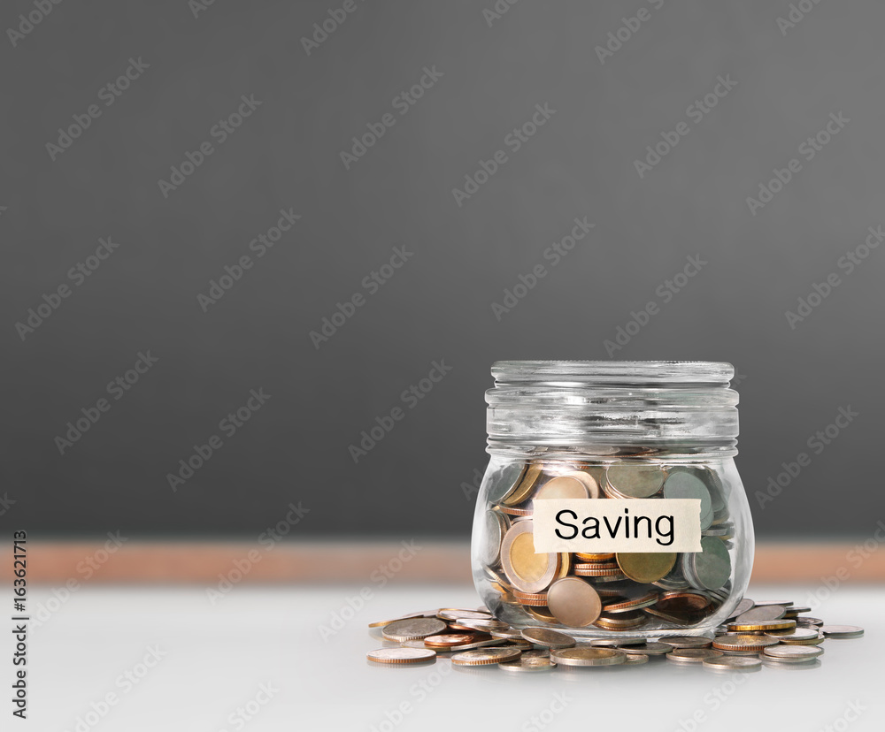 Silver coins in piggy bank Glass Silver coins in piggy bank Glass