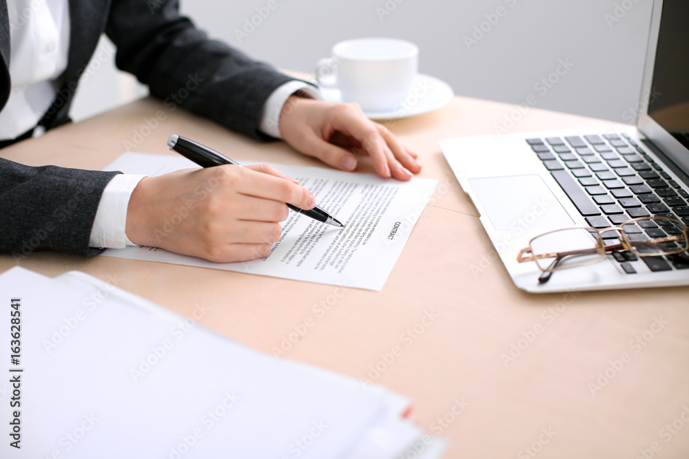 Business woman ready to sign a contract Business woman ready to sign a contract