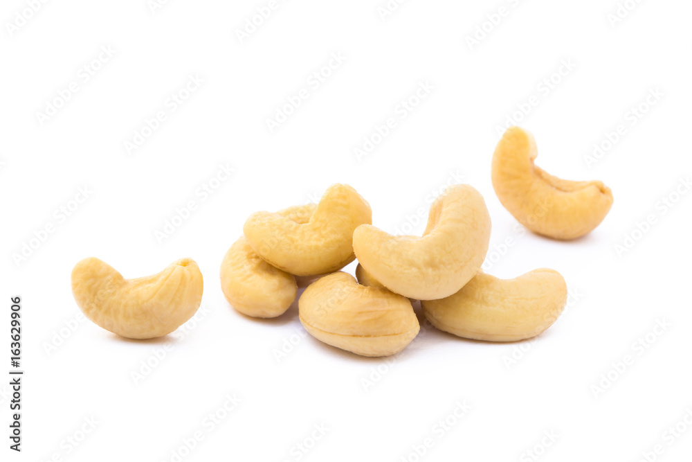 Roasted salted cashews isolated on a white background Roasted salted cashews isolated on a white background