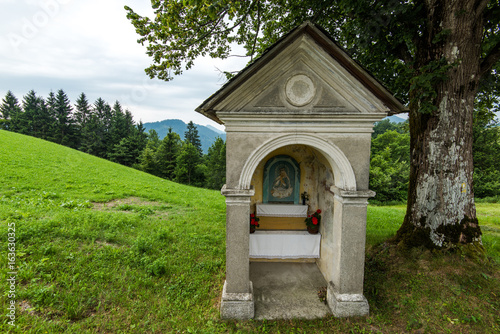 Chapel on roadside in rural Slovenia photo