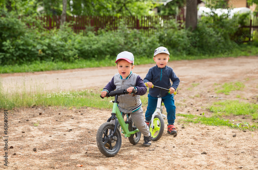 Children on a balance bike Children on a balance bike