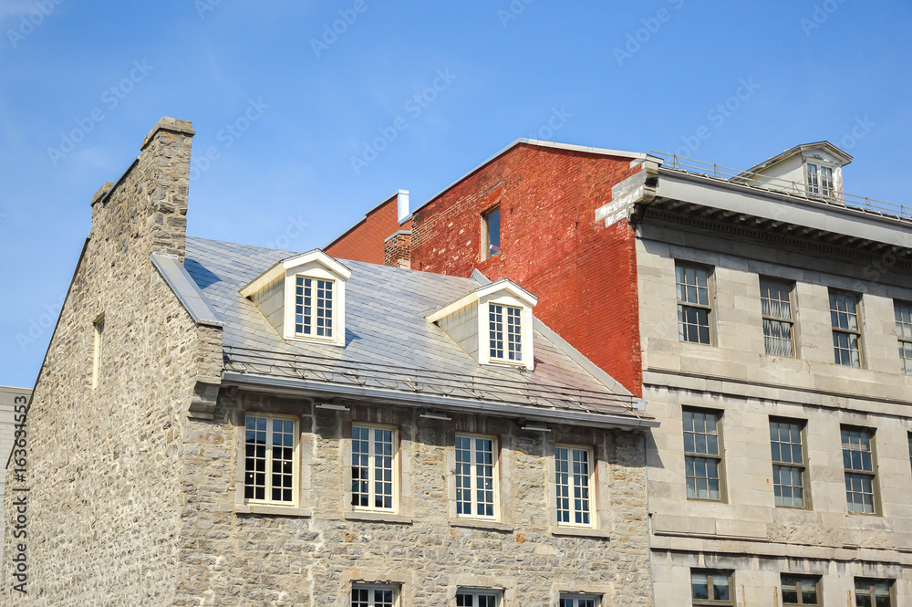 An old historical building with the large windows in the old port of Montreal on Jacques Cartier place.Place Jacques-Cartier, Canada An old historical building with the large windows in the old port of Montreal on Jacques Cartier place.Place Jacques-Cartier, Canada