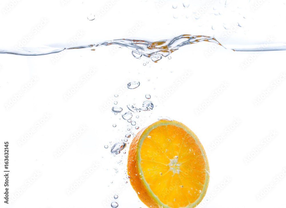 orange slice in water splash. white background orange slice in water splash. white background