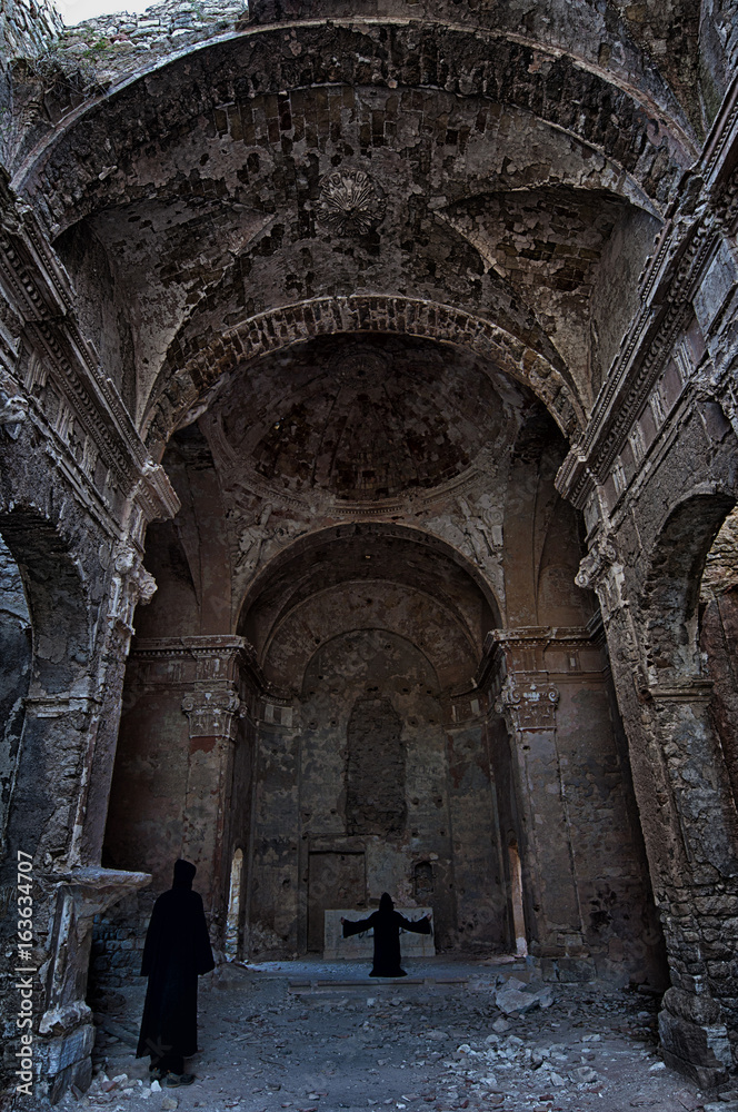 Monks inside an abandoned church