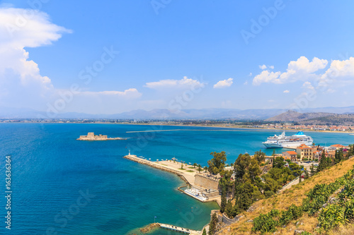 Bourtzi water fortress in Nafplio. Nafplio is a seaport town in the Peloponnese peninsula in Greece