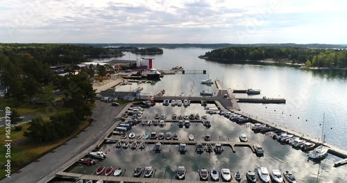 Kasnas, Cinema 4k aerial view above kasnas harbor, full of boats, in the finnish archipelago, in Varsinais-suomi, Finland photo