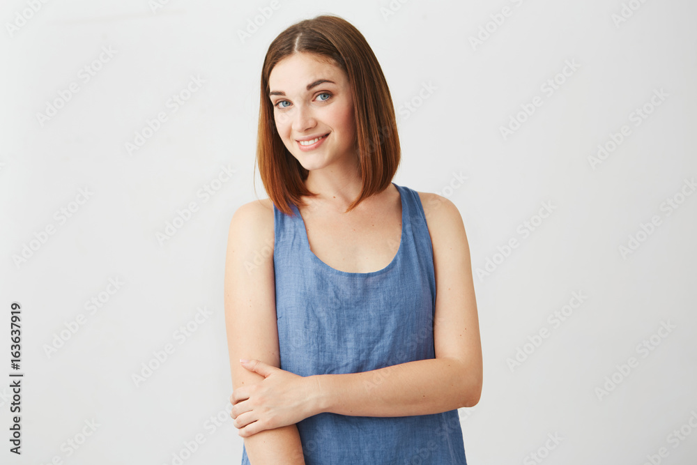 Portrait of beautiful brunette cute girl smiling looking at camera over white background. Portrait of beautiful brunette cute girl smiling looking at camera over white background.