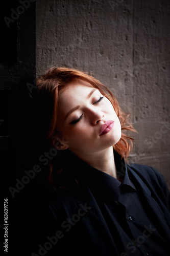 Beautiful red-haired girl with plump lips. A natural beauty. Ginger