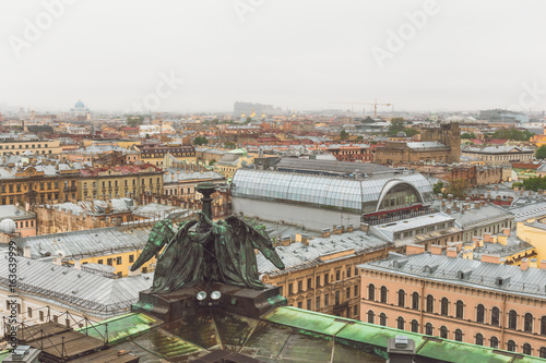 View from the roof, colonnade of St. Isaac's Cathedral in St. Petersburg on a cloudy rainy day © DedMityay
